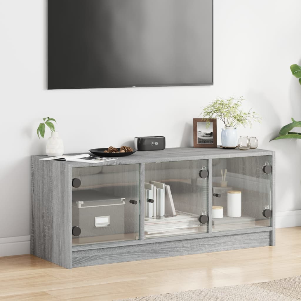 vidaXL Comodă TV cu uși din sticlă, gri sonoma, 102x37x42 cm vidaXL Comodă TV cu uși din sticlă, gri sonoma, 102x37x42 cm