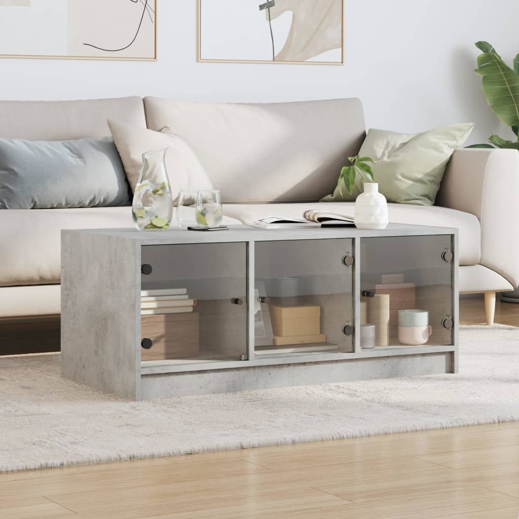vidaXL Măsuță de cafea cu uși din sticlă, gri beton, 102x50x42 cm vidaXL Măsuță de cafea cu uși din sticlă, gri beton, 102x50x42 cm