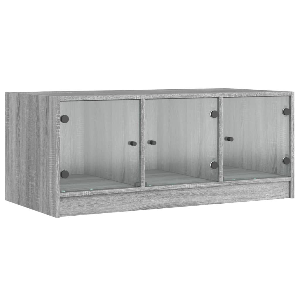 vidaXL Măsuță de cafea cu uși din sticlă, gri sonoma, 102x50x42 cm vidaXL Măsuță de cafea cu uși din sticlă, gri sonoma, 102x50x42 cm