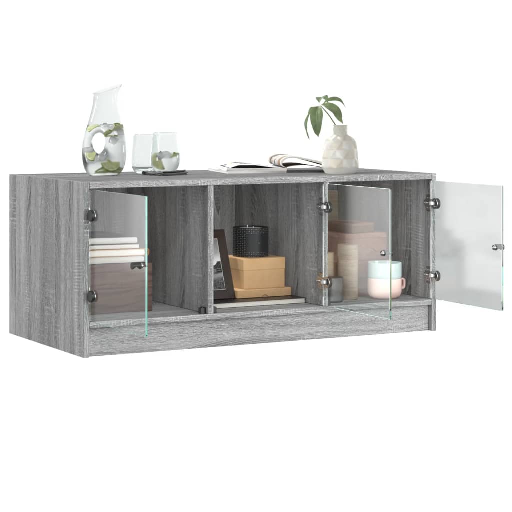 vidaXL Măsuță de cafea cu uși din sticlă, gri sonoma, 102x50x42 cm vidaXL Măsuță de cafea cu uși din sticlă, gri sonoma, 102x50x42 cm